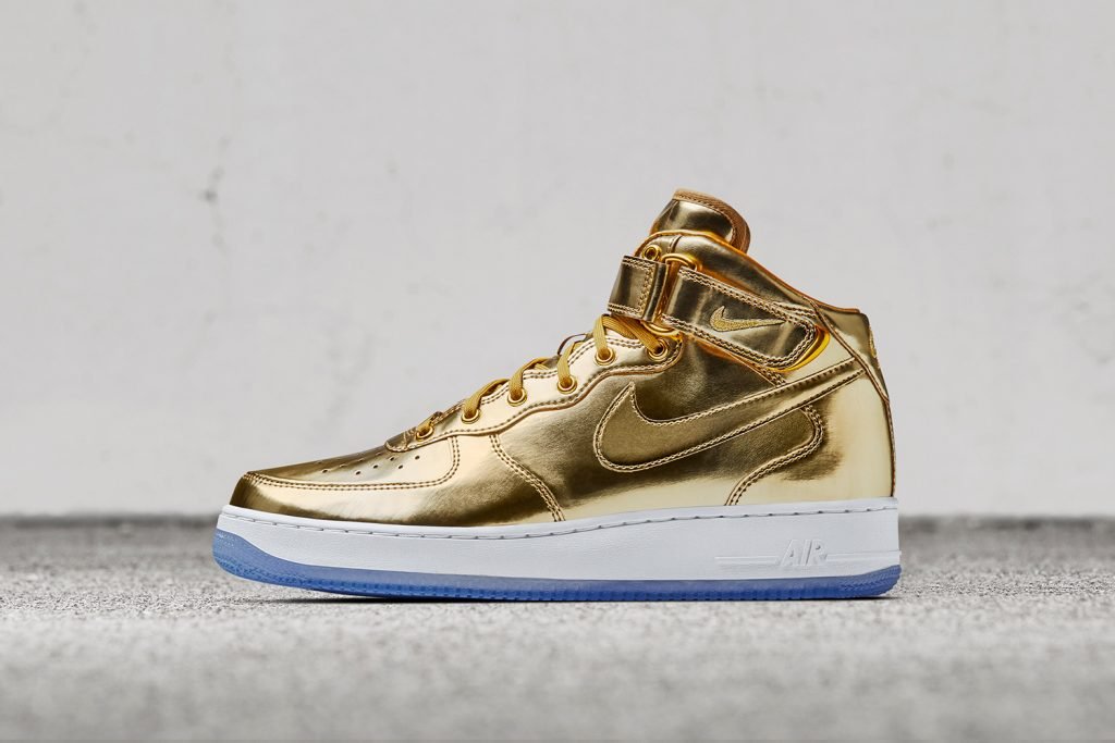 black and gold kids nike